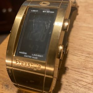 Freestyle digital watch. Gold colored